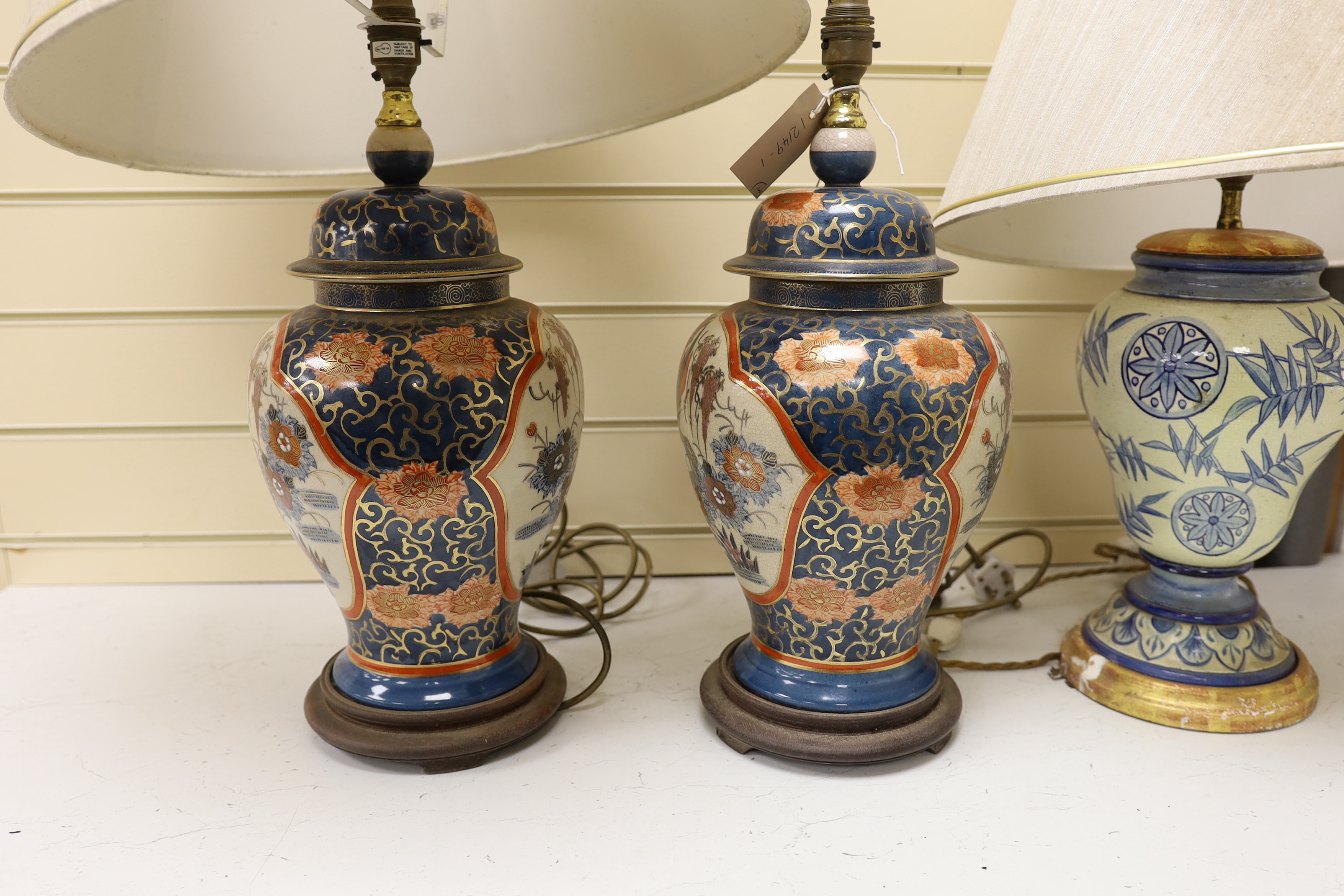 A pair of Chinese crackleware lamps, 40cm high, and a European pottery lamp (3)